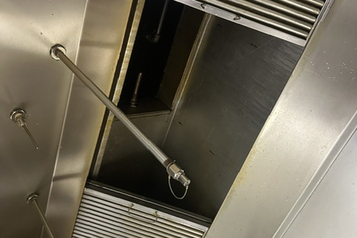 Technician working on commercial hood system